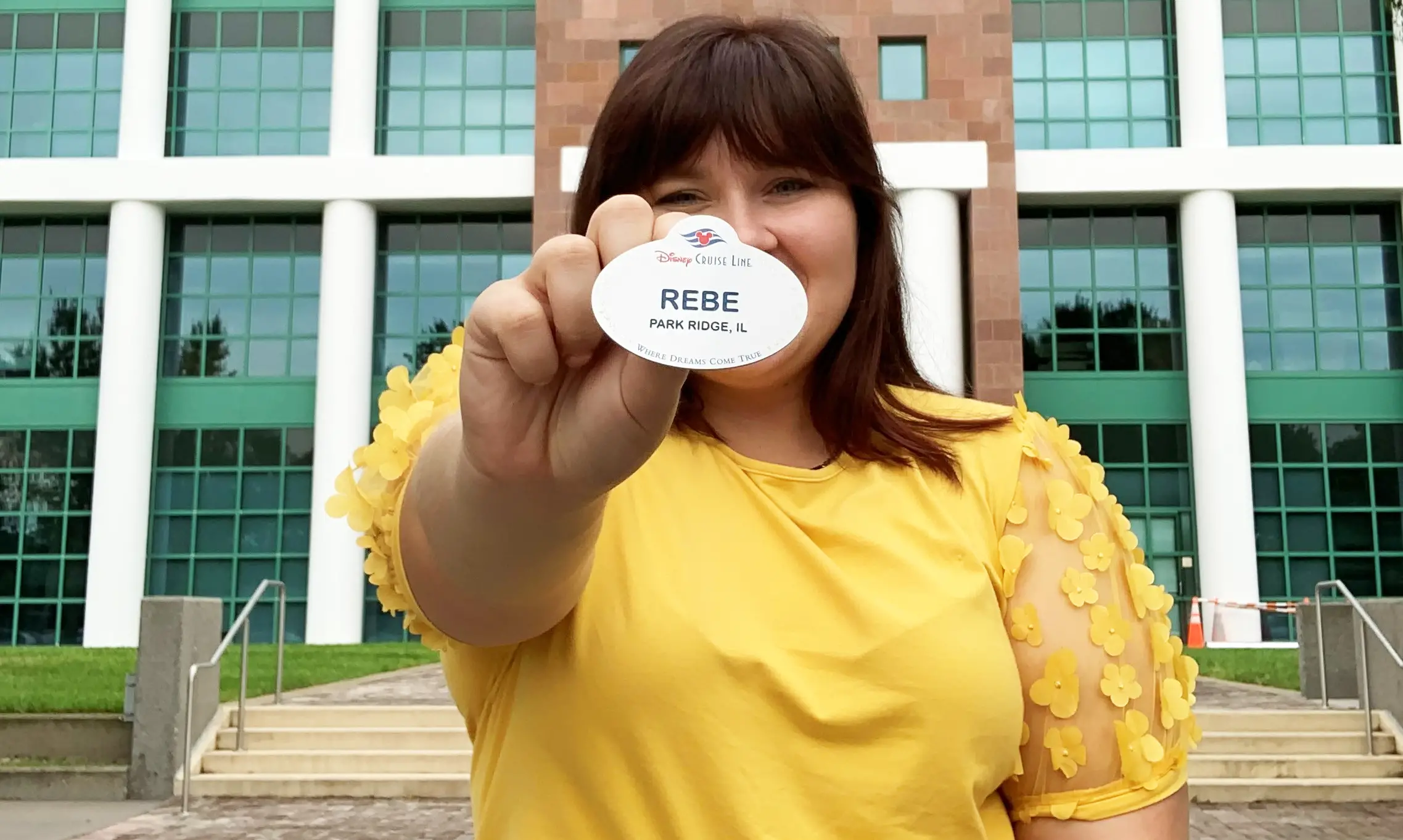 person holding a name tag