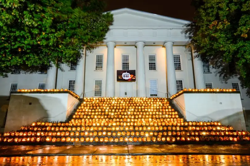 An image of PumpkinMania at night on the steps of Old Morrison