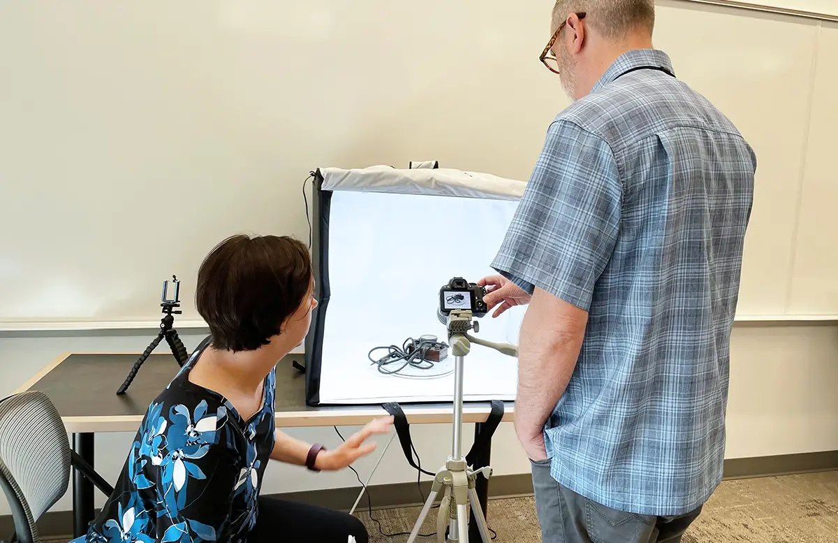 people photographing an object