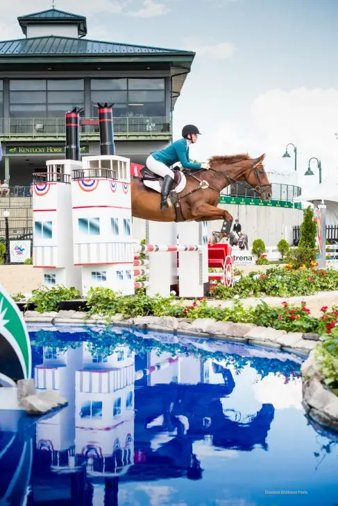 Lily Callahan takes a jump on her saddlebred horse, Moose.