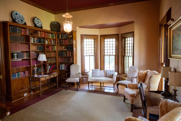 Graham Cottage interior - sitting area with bay window and bookshelf