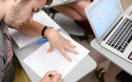 two students working together in a classroom
