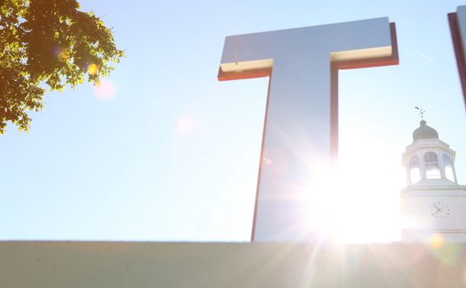 detail of tranyslvania sign on campus. Carpenter Center cupola in background