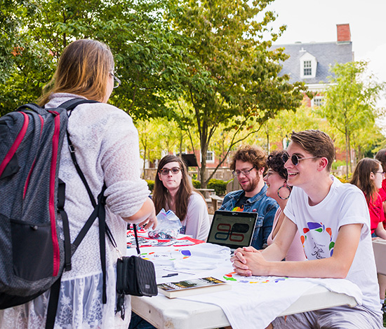 students having fun at campus organization signup day