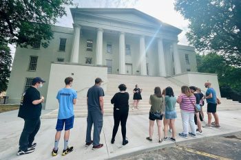 Group taking a campus tour, in front of Old Morrison