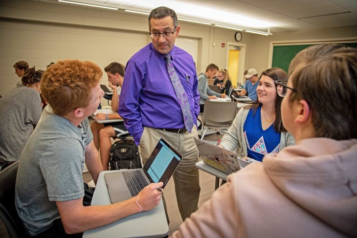 Professor Michael Cairo speaking to students in a classroom