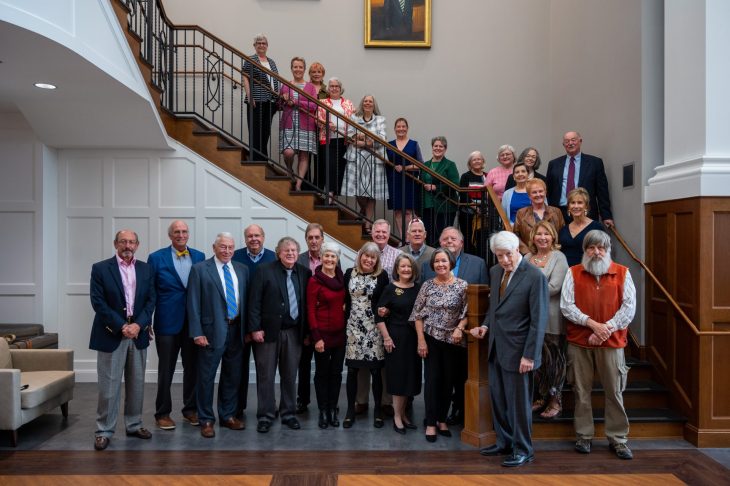 group of alumni on the steps in the campus center