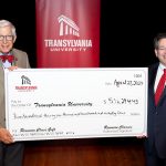 John Williams and Brien Lewis holding a giant check