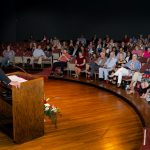 man addressing an audience