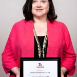 portrait of Shannan Stamper holding award