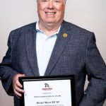 portrait of Dexter Meyer III holding award