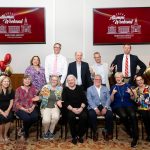 group of alumni posing for photo
