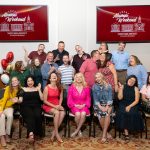 group of alumni posing for photo