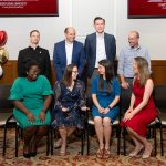 group of alumni posing for photo