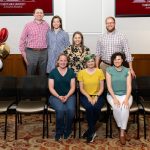 group of alumni posing for photo