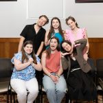 group of alumni silly posing for photo