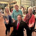 alumni posing for photo with Brien Lewis