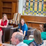 alumni sitting in chairs