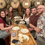 alumni pose for photo