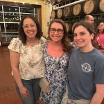 alumni pose for photo