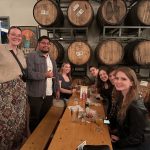 alumni pose for photo