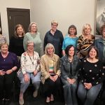 group of alumni posing for photo