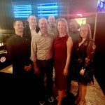 group of alumni posing for photo