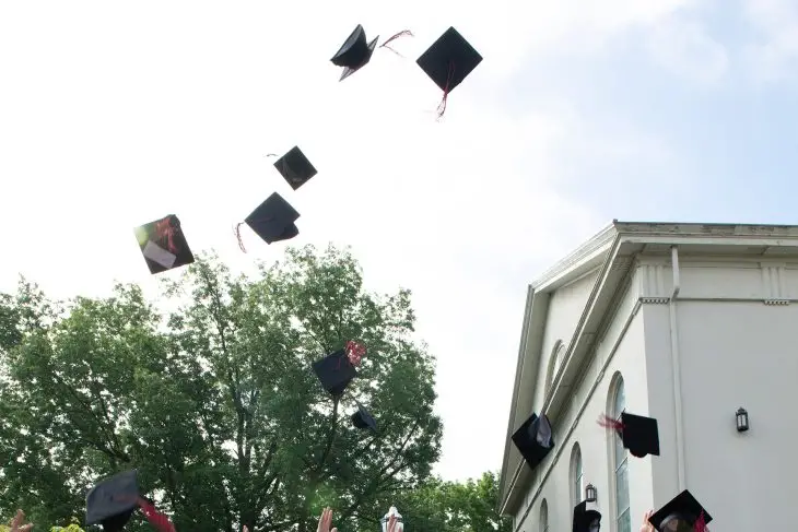 caps being tossed in the air at graduation