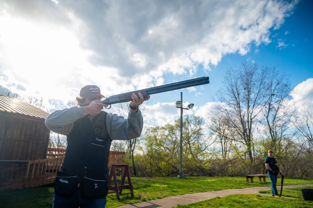 Clay target shooter with sun behind