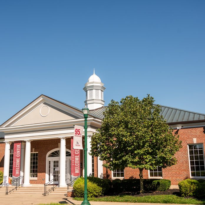 Glen building with welcome center banners