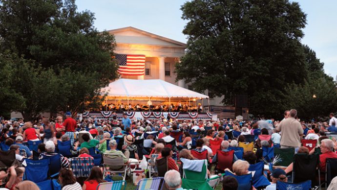 people gathered in front of old morrison for a patriotic independence day concert