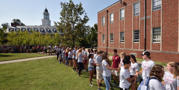 two lines of students shaking hands