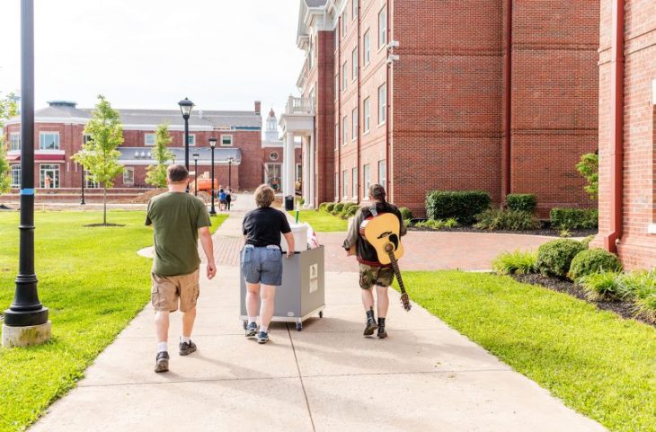 Students moving in to campus residence halls