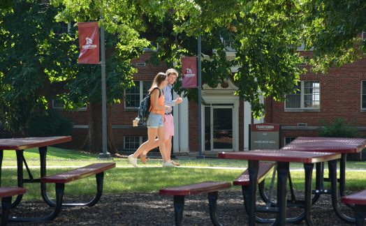 two students walking on campus