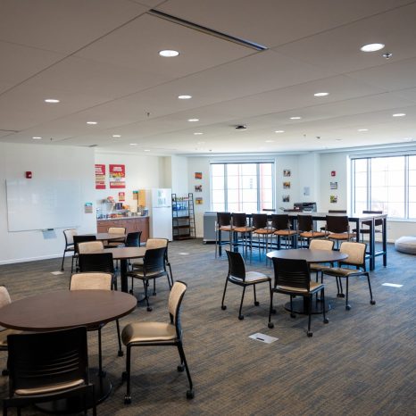 speaker addressing group of parents and prospective students at an admissions event