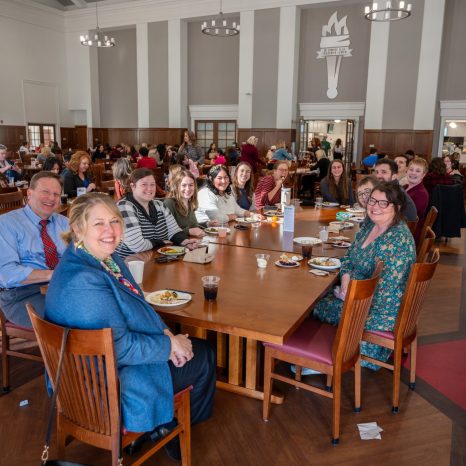 Group seated at table for meal