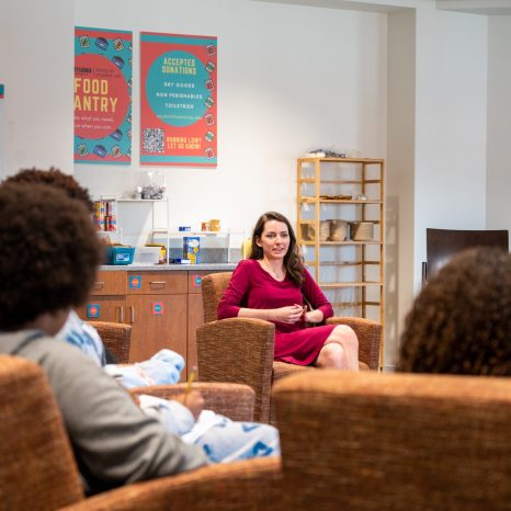 diverse young adults listening to guest speaker
