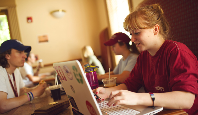 Student with computer at Gratz Perk