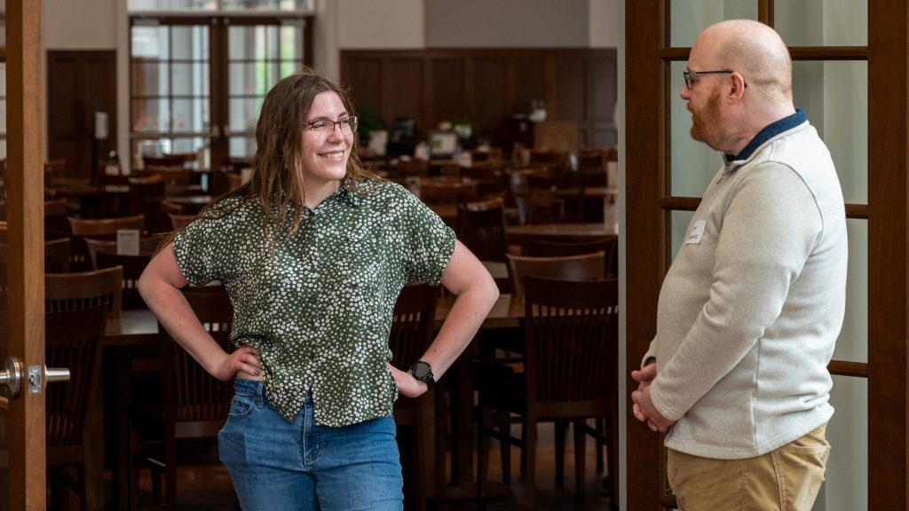 Student smiling with mentor