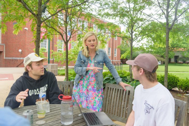 professor Christi Hayne instructing a class outdoors on Transylvania campus