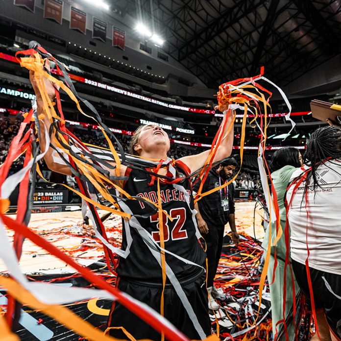 Laken Ball celebrates with streamers after the national championship win.