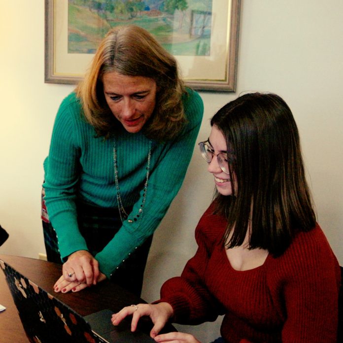 Tracy Dunn and Kaitlyn Maes in the CAPE office.