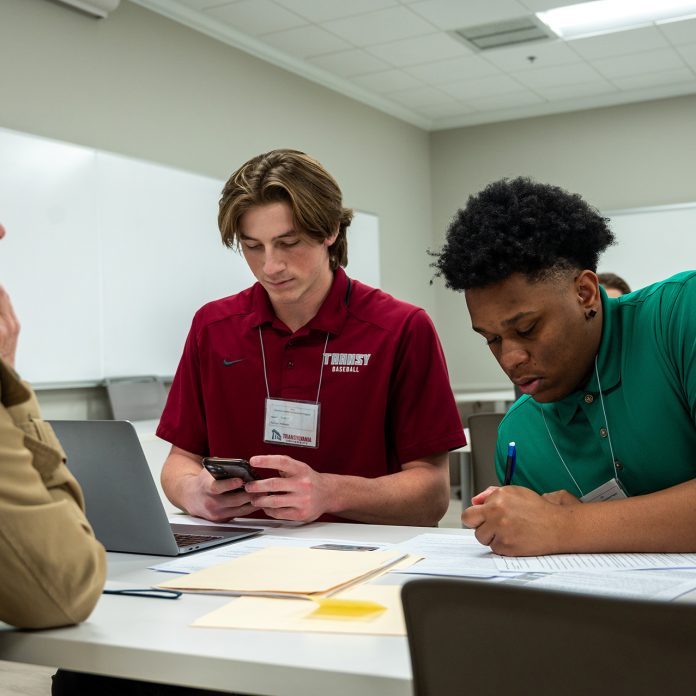 Students providing tax preparation assistance