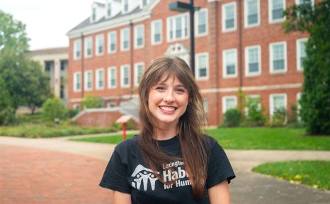 student standing in front of carpenter academic center
