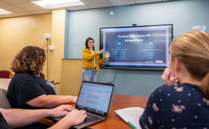 small group of students watching a presentation