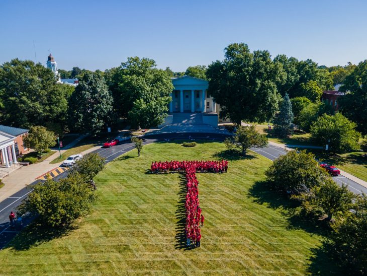 group of students in a T formation on Old Morrison lawn