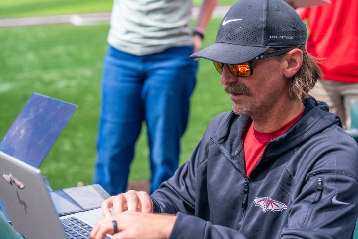 coach using his laptop