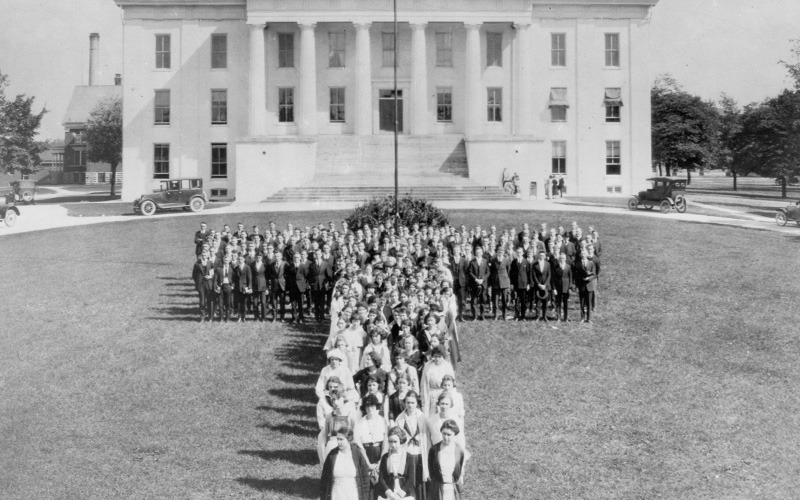 Archival photo of Transy Students standing in a 'T' formation in front of Old Morrison