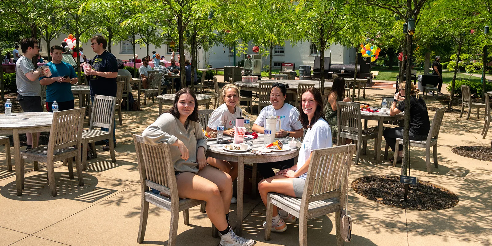 students sitting at a table on the Transylvania campus